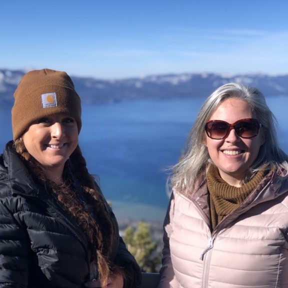 Jennifer Marriott and Belinda Peavey in front of Lake Tahoe.