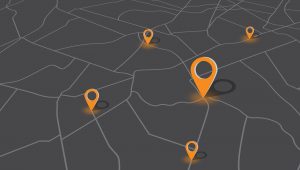 Stylized map with geolocation pins symbolizing data collection points, representing location-based travel behavior insights.