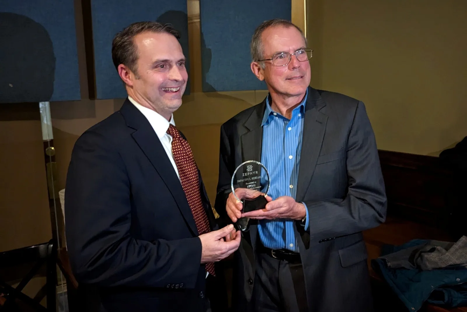 RSG Principal Bill Woodford receives the Zephyr Award alongside RSG's FTA client.
